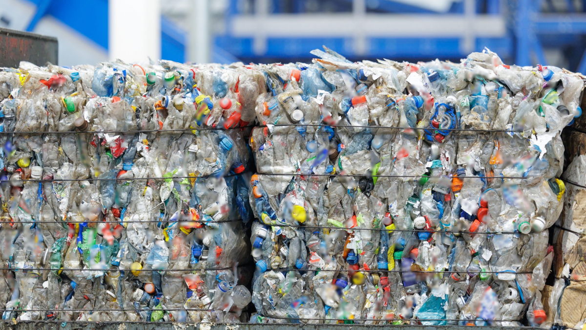 Stacks,Of,Compressed,Plastic,Bottles,And,Containers,In,Recycling,Facility